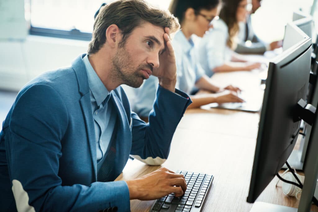 employee looking at data backup on computer