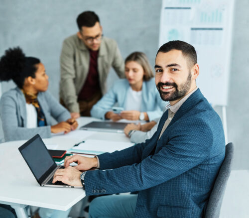 Young business people work around a table